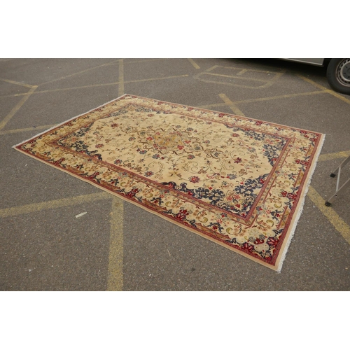 1061 - A cream ground Kashan carpet with Royal design, 200 x 290cm