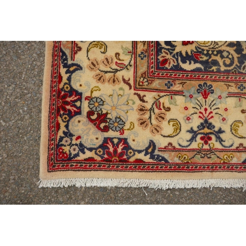 1061 - A cream ground Kashan carpet with Royal design, 200 x 290cm