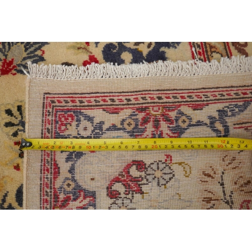 1061 - A cream ground Kashan carpet with Royal design, 200 x 290cm