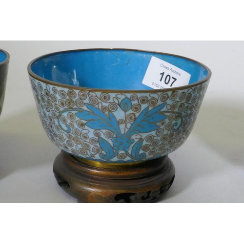 107 - Four Chinese cloisonne enamel bowls on wood stands, late C19th/early C20th