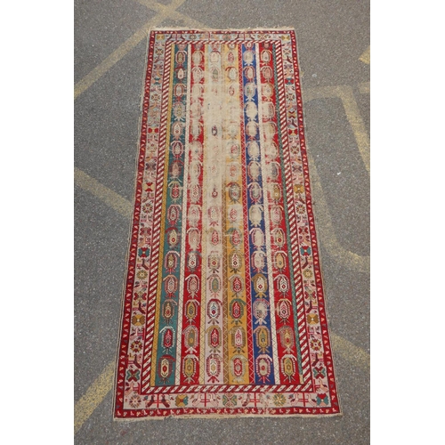 1071 - An antique multicolour Caucasian Shirvan runner, worn, 125 x 284cm