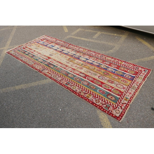 1071 - An antique multicolour Caucasian Shirvan runner, worn, 125 x 284cm