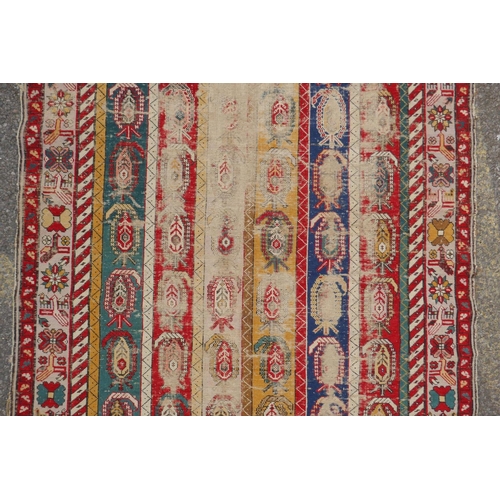 1071 - An antique multicolour Caucasian Shirvan runner, worn, 125 x 284cm