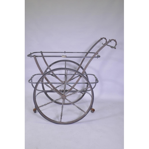 1073 - A vintage brass drinks trolley, lacks glass tops, 97 x 50 x 100cm