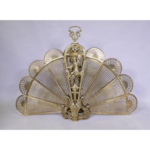 1076 - A brass fan shaped fire guard, handle detached and retaining clip, AF, 125 x 87cm