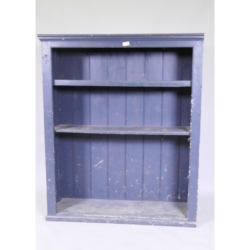 1078 - A painted open book-case with two shelves, raised on a plinth base, 102 x 34 x 123 cm