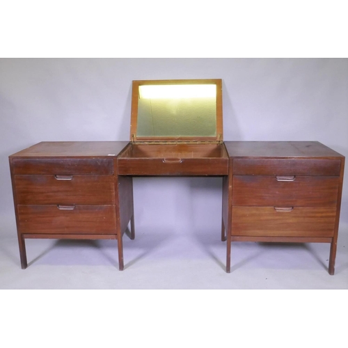 1083 - A mid century teak dressing table, comprising two end sections and removable centre section with fol... 