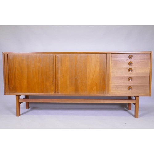 1098 - A mid century Scandinavian teak 'Oden' sideboard by Nils Johsson for Troeds, with tambour front and ... 