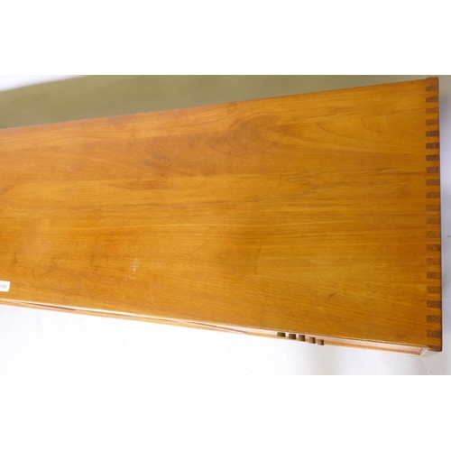 1098 - A mid century Scandinavian teak 'Oden' sideboard by Nils Johsson for Troeds, with tambour front and ... 