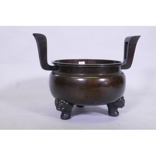 11 - A large Japanese bronze censer, raised on tripod supports, AF detached, bowl 40cm diameter, 47cm hig... 