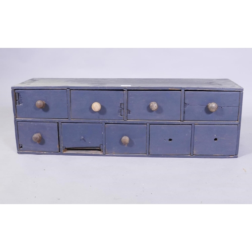 1100 - A painted nest of nine drawers, 87 x 27 x 27 cm