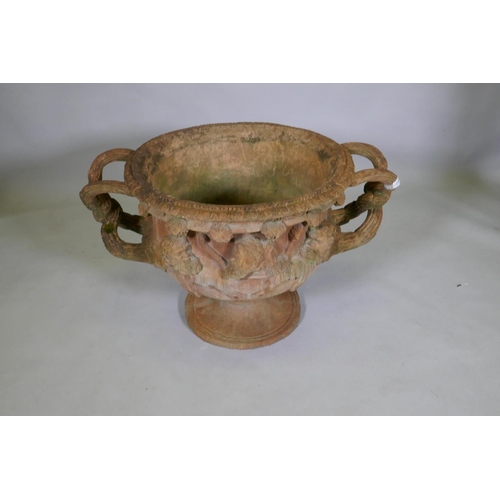 1101 - A terracotta garden urn in the form of the Warwick Vase, after the antique, 58cm diameter x 50cm hig... 