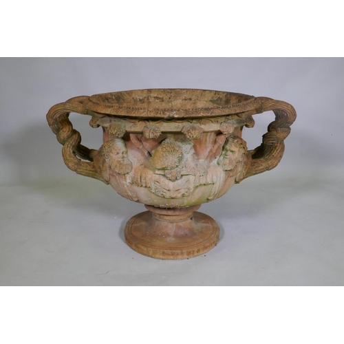 1101 - A terracotta garden urn in the form of the Warwick Vase, after the antique, 58cm diameter x 50cm hig... 