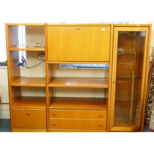 1102 - A Hulsta cherry wood veneered wall cabinet, with open shelves, fall front, illuminated cocktail cabi... 