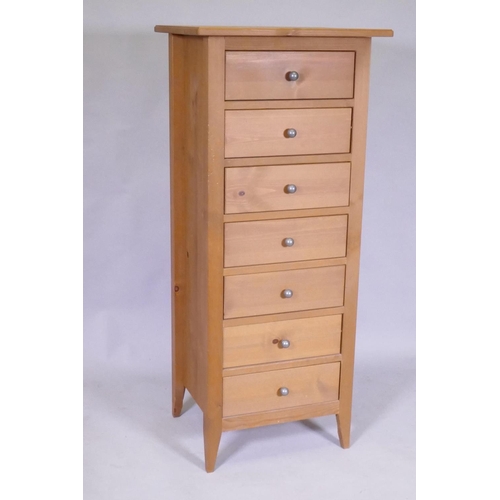 1107 - A contemporary seven drawer pine chest, 53 x 42 x 121cm