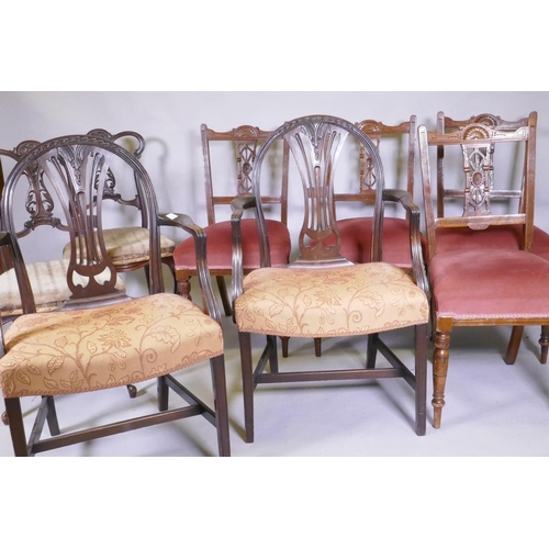 1109 - A pair of Hepplewhite style arm chairs, a pair of Victorian side-chairs, with carved and pierced bac... 