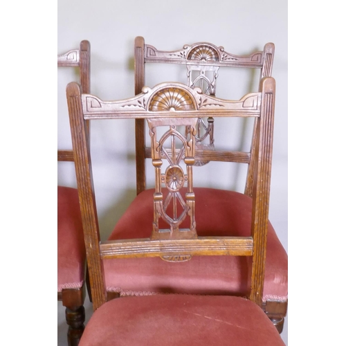 1109 - A pair of Hepplewhite style arm chairs, a pair of Victorian side-chairs, with carved and pierced bac... 