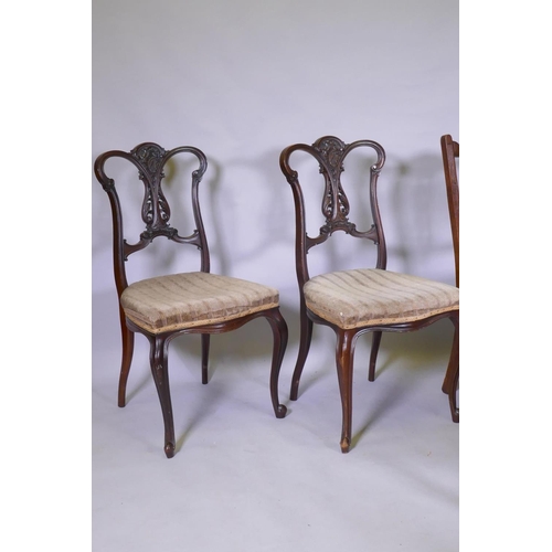 1109 - A pair of Hepplewhite style arm chairs, a pair of Victorian side-chairs, with carved and pierced bac... 