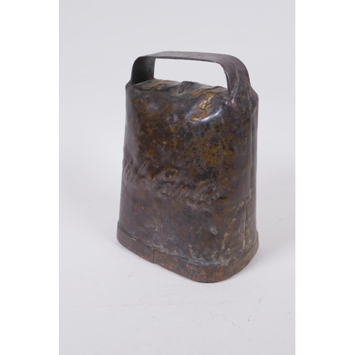 111 - An antique continental cow bell, 14 x 19cm