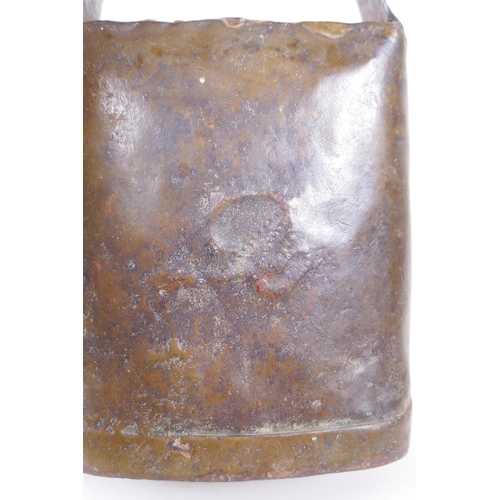 111 - An antique continental cow bell, 14 x 19cm