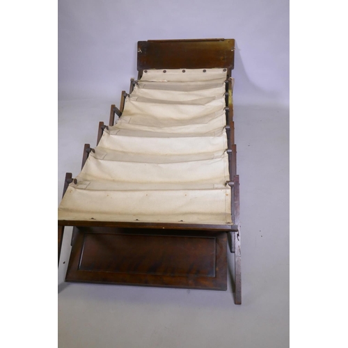 1111 - An officer's military campaign bed with concertina action, 25 x 809 x 52cm, and two sets of bamboo a... 