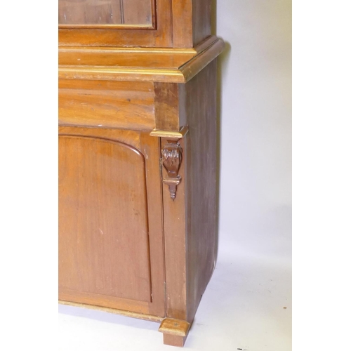 1115 - A C19th French stained fruitwood and walnut armoire de cuisine, the upper section with two glazed do... 