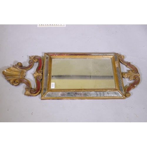 1117 - A Venetian painted and giltwood cushion shaped wall mirror, early C20th, 35 x 90cm