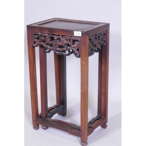 1119 - A nest of two Chinese hardwood tables, with carved and pierced dragon frieze, square supports and sh... 