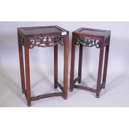 1119 - A nest of two Chinese hardwood tables, with carved and pierced dragon frieze, square supports and sh... 