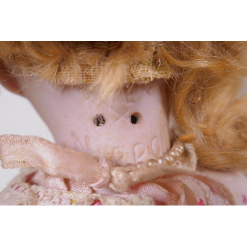 115 - An Armand Marseille bisque headed doll, No 370 5/0, with sleeping eyes, circa 1900, together with a ... 