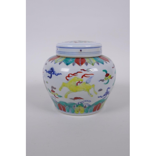 118 - A Chinese Wucai porcelain ginger jar and cover decorated with mythical creatures, character mark to ... 