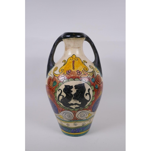 119 - An antique Majolica amphora decorated with rampant lions, 38cm high