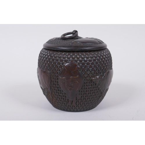 120 - A Chinese bronze jar and cover of basket form, with water buffalo decoration, impressed Xuande 4 cha... 