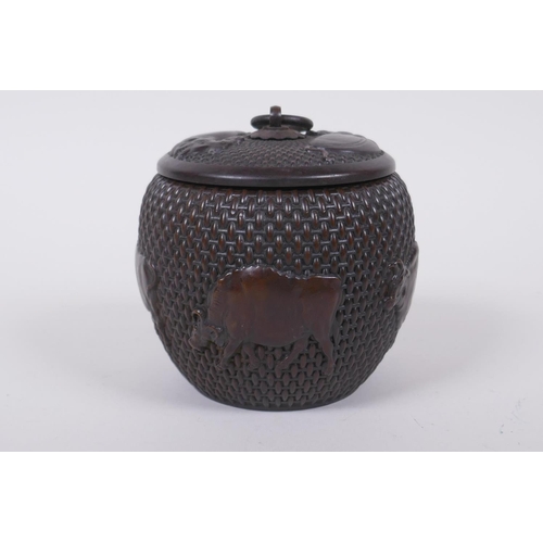 120 - A Chinese bronze jar and cover of basket form, with water buffalo decoration, impressed Xuande 4 cha... 