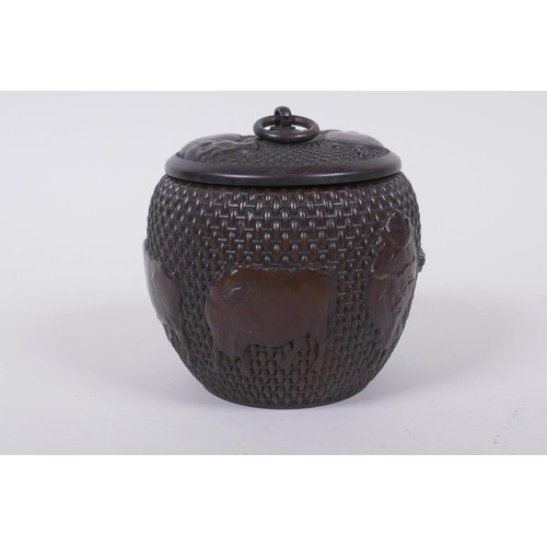 120 - A Chinese bronze jar and cover of basket form, with water buffalo decoration, impressed Xuande 4 cha... 