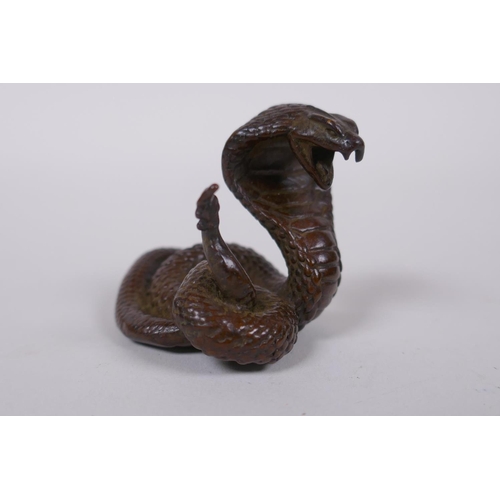 125 - A Japanese style bronze okimono cobra, mark to base, 4cm high