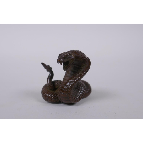 125 - A Japanese style bronze okimono cobra, mark to base, 4cm high