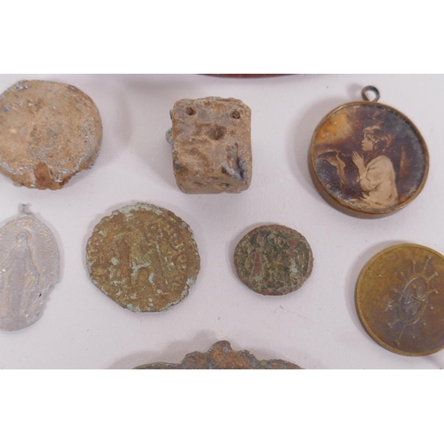 128 - A quantity of detectorist finds including Roman coins, buckles, mounts, shell casings etc