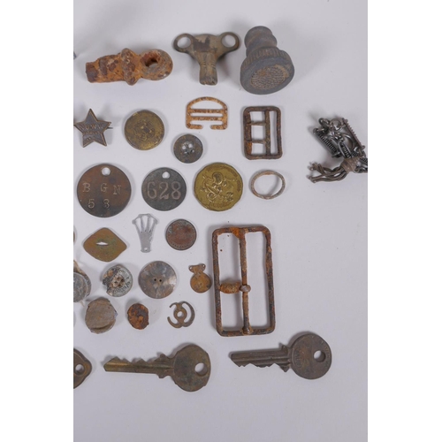 128 - A quantity of detectorist finds including Roman coins, buckles, mounts, shell casings etc