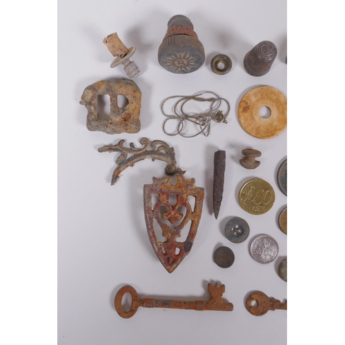 128 - A quantity of detectorist finds including Roman coins, buckles, mounts, shell casings etc