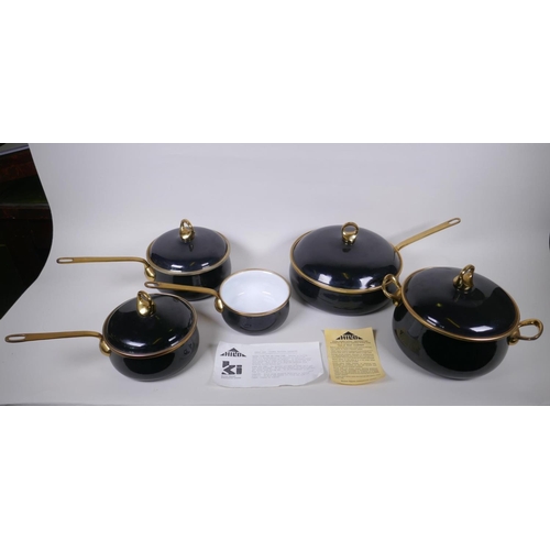 133 - A set of Kitchen Kapers International Ltd 'Hild' enamelled cookware with brass handles, in the Ebony... 