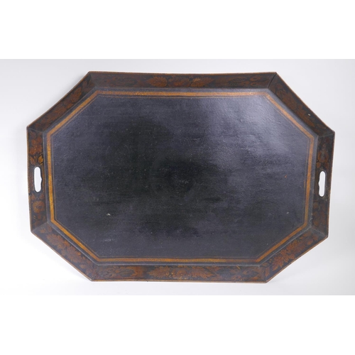 214 - A Toleware tray with painted decoration of a rural ruin, and another larger, 76 x 54cm