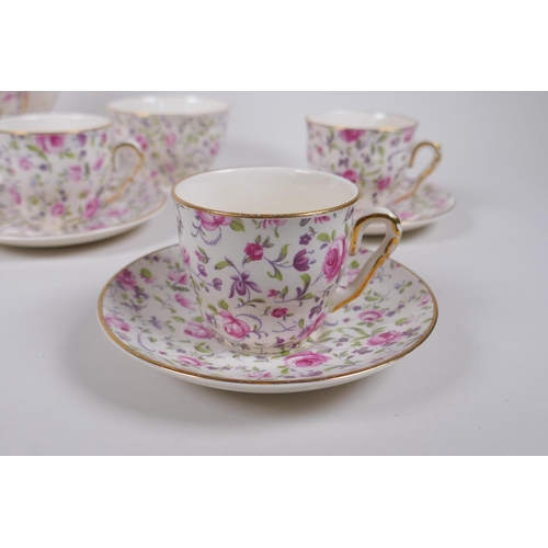 222 - An Arklow pottery six piece coffee set with a transfer printed rose decoration, one cup different, l... 
