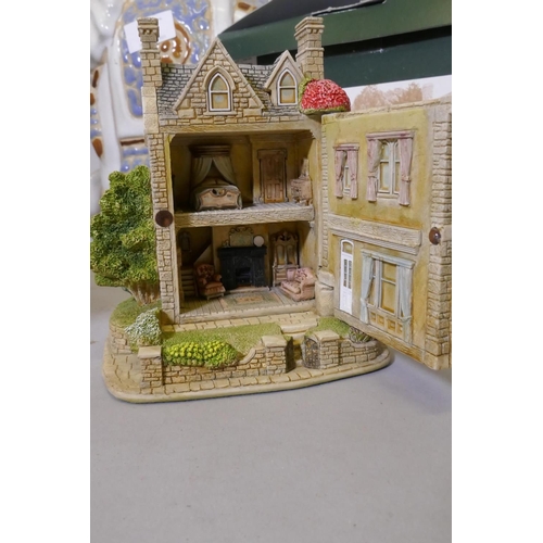 25 - A Lilliput Lane dolls' house, a 'Welcome Father Christmas' porcelain ornament by Janet King, a plant... 