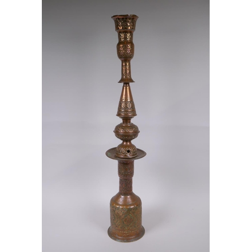 26 - A middle eastern copper and brass hookah pipe with repousse floral decoration, 72cm high