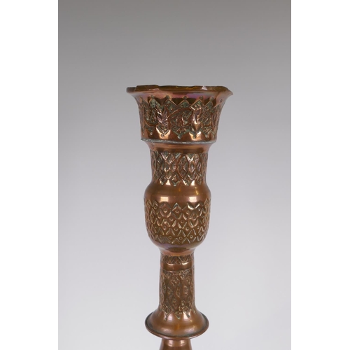 26 - A middle eastern copper and brass hookah pipe with repousse floral decoration, 72cm high