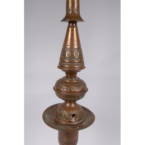 26 - A middle eastern copper and brass hookah pipe with repousse floral decoration, 72cm high