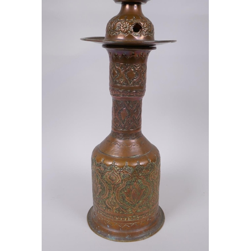 26 - A middle eastern copper and brass hookah pipe with repousse floral decoration, 72cm high