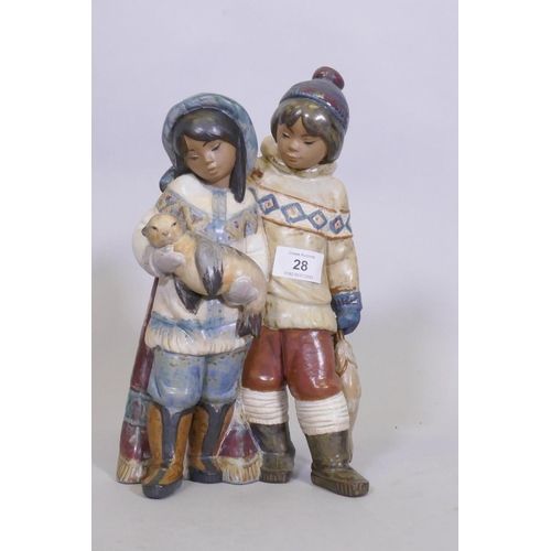 28 - A rare Lladro figure group, Arctic Allies, No 12227, of two Eskimo children with a seal pup, stamp a... 