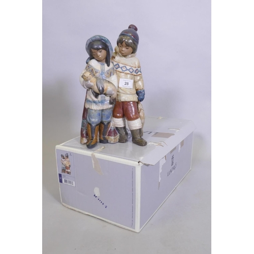 28 - A rare Lladro figure group, Arctic Allies, No 12227, of two Eskimo children with a seal pup, stamp a... 